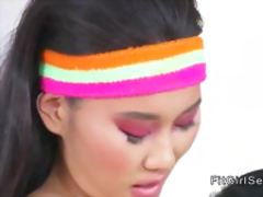 Brunette and Asian lesbians at the gym